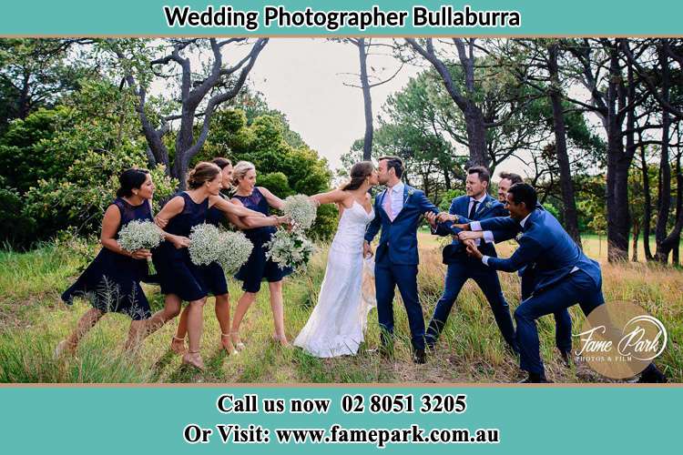 Photo of the new couple kissing as their entourage tries to keep them apart Bullaburra NSW 2784