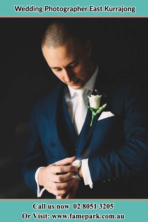 Photo of Groom checking his watch East Kurrajong NSW 2758