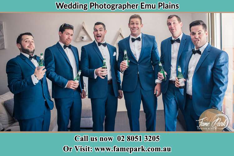 The groom and his groomsmen striking a wacky pose in front of the camera Freemans Reach NSW 2756