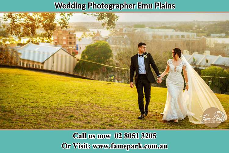 Bride and Groom walking in the yard Freemans Reach NSW 2756