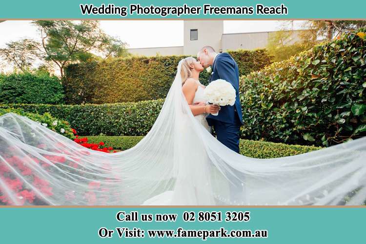 Bride and Groom kiss at the garden Freemans Reach NSW 2756