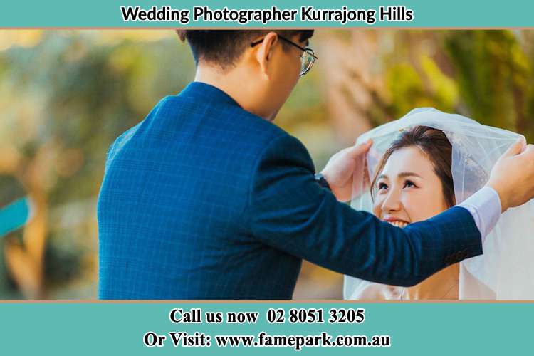 Groom hold the veil of his Bride Kurrajong Hills NSW 2758