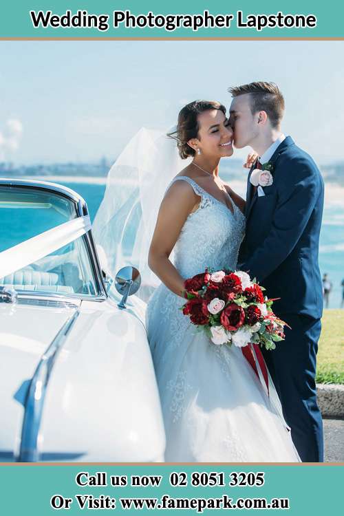 Groom kissed the bride near the Bridal car Lapstone NSW 2773